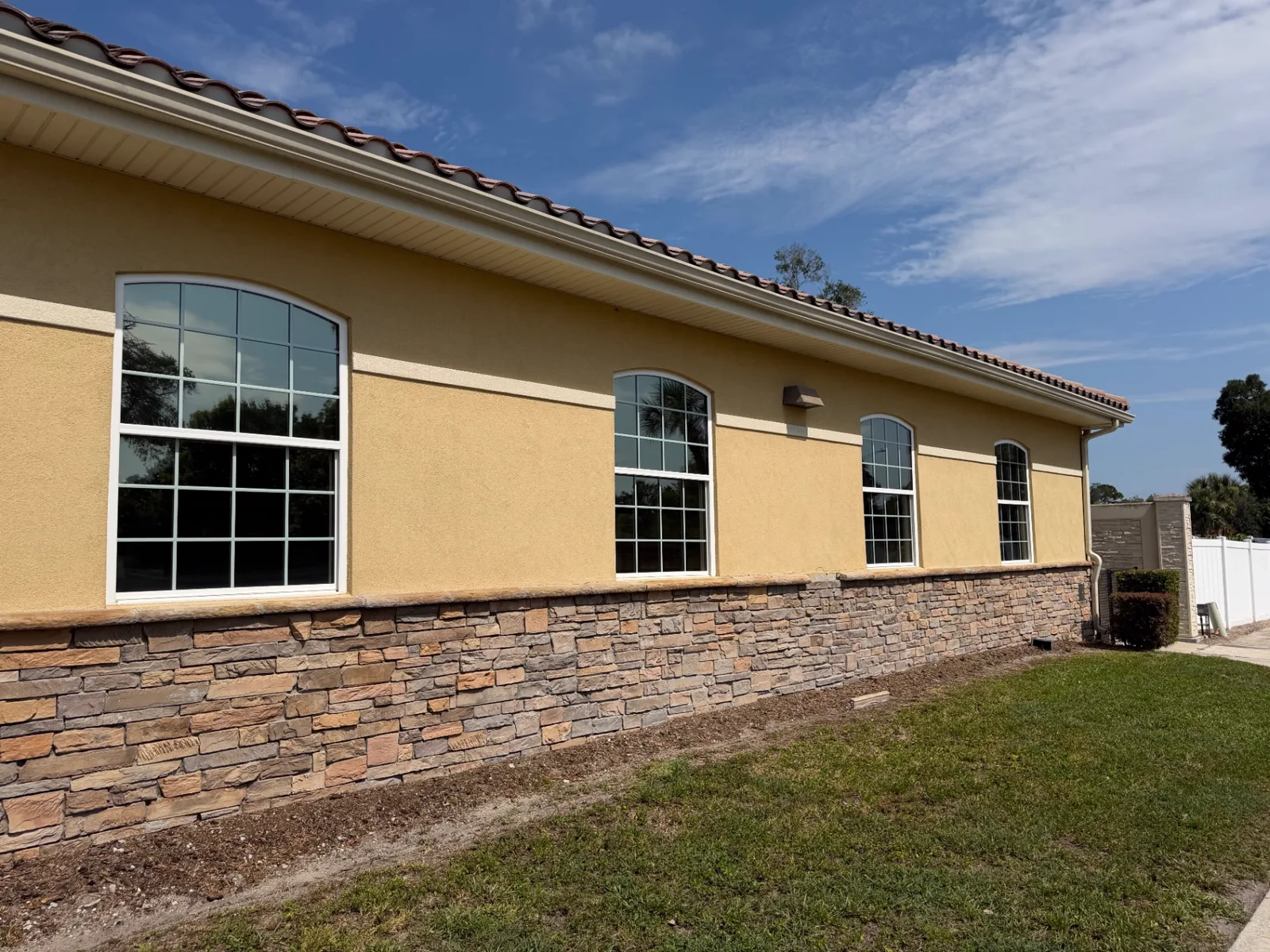 Summit Window Tinting commercial install — Clubhouse · arched glass heat rejection