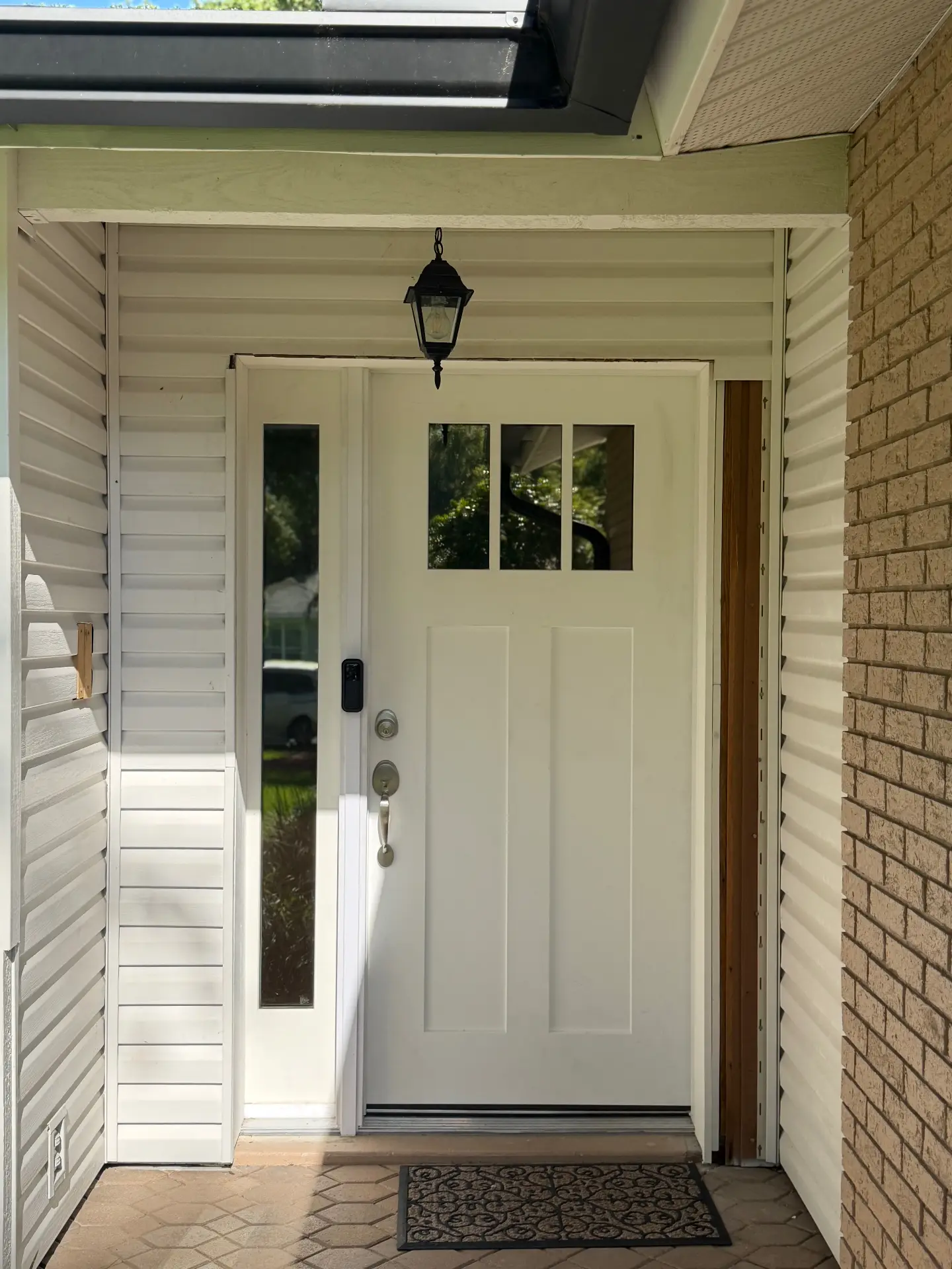 Summit Window Tinting residential install — Front entry glass · UV protection