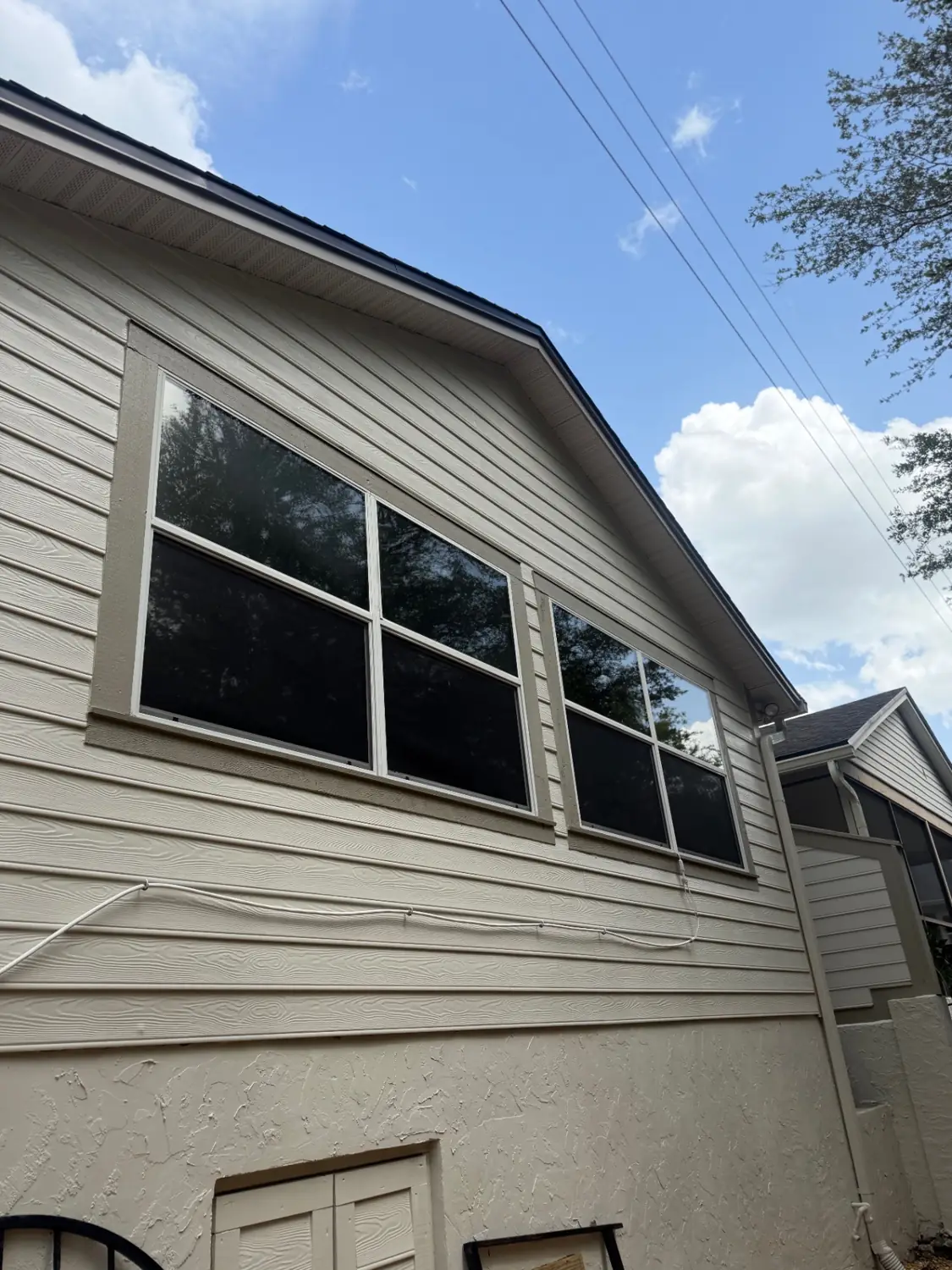 Summit Window Tinting residential install — Second-story windows · dark solar control