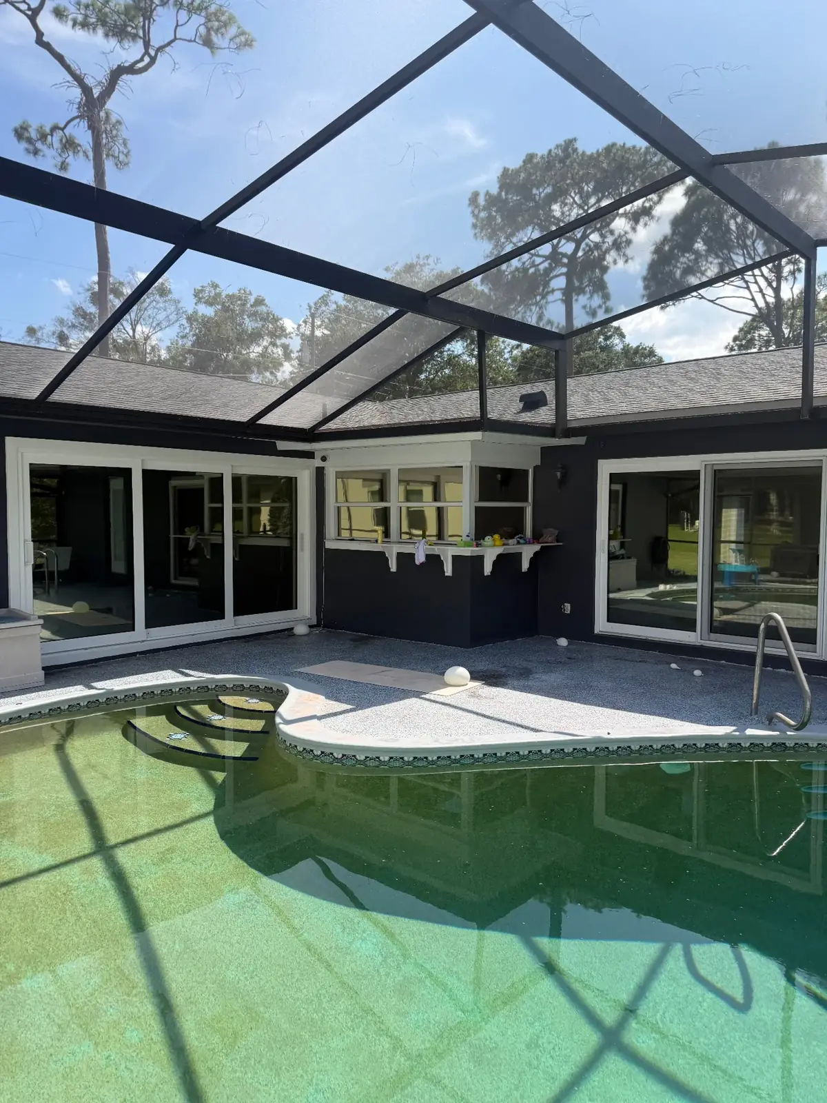Summit Window Tinting residential install — Screened pool lanai · sliders with heat-rejection film