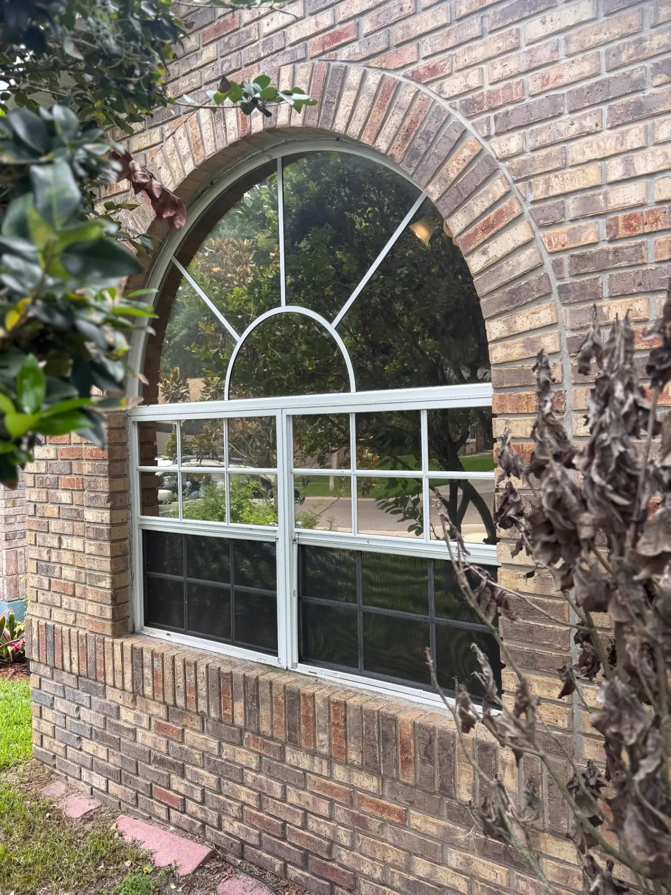 Summit Window Tinting residential install — Brick arch window · heat-rejection film